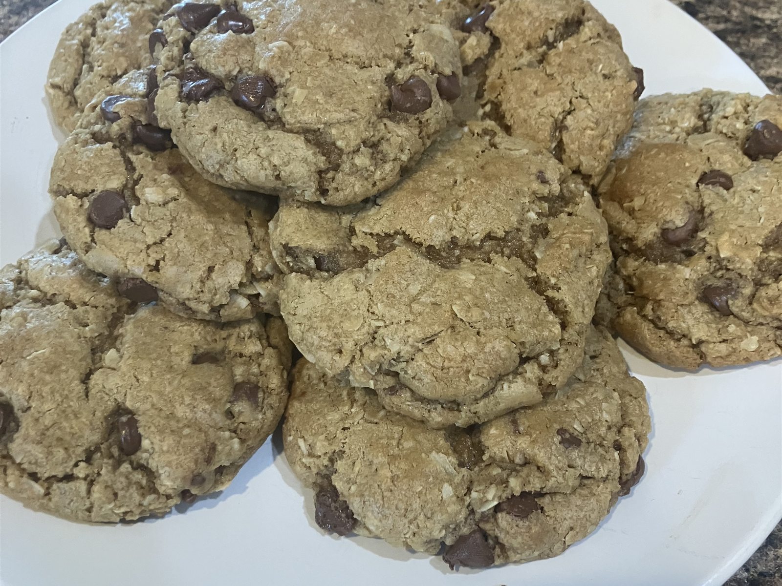 A plate stacked with chocolate chip cookies