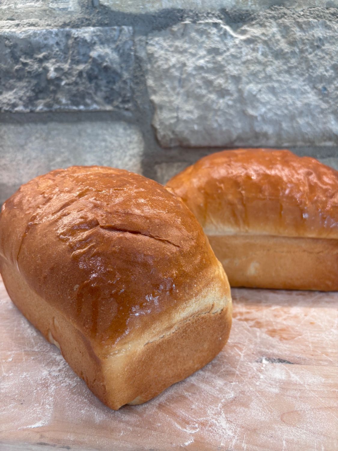 White sandwich bread loaves dusted with flour
